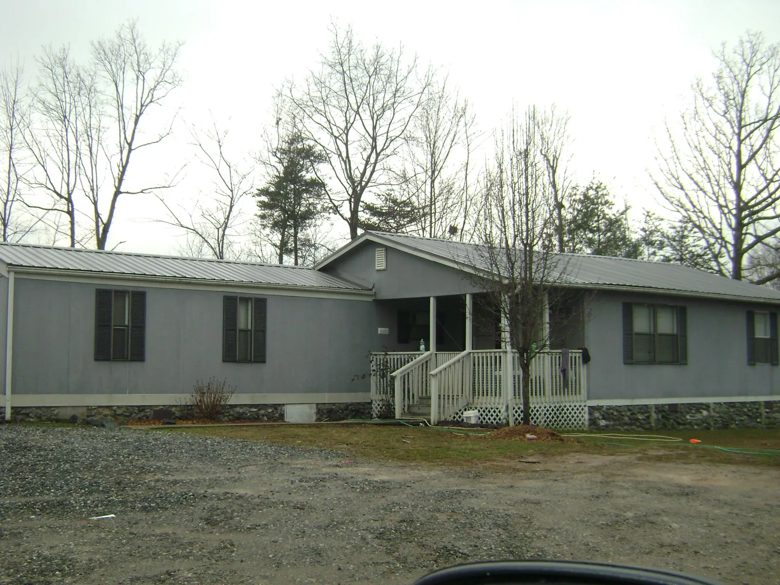 Metal roof over a manufactured home with a covered front porch in Lebanon